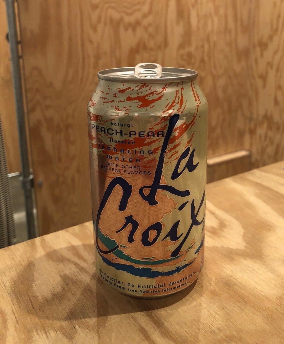 La Croix Naturally Essenced Peach Pear Sparkling Water packshot