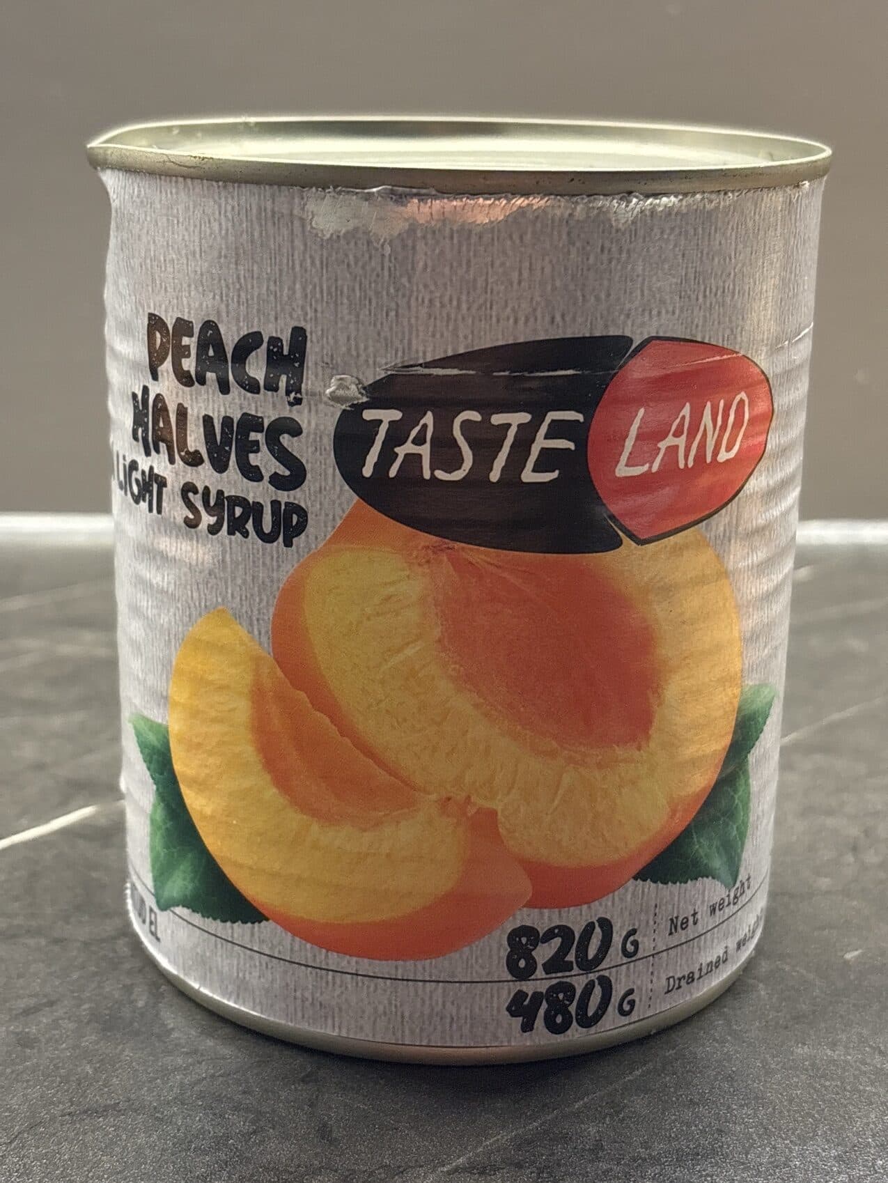 TASTE LAND Persikų puselės silpname sirupe packshot