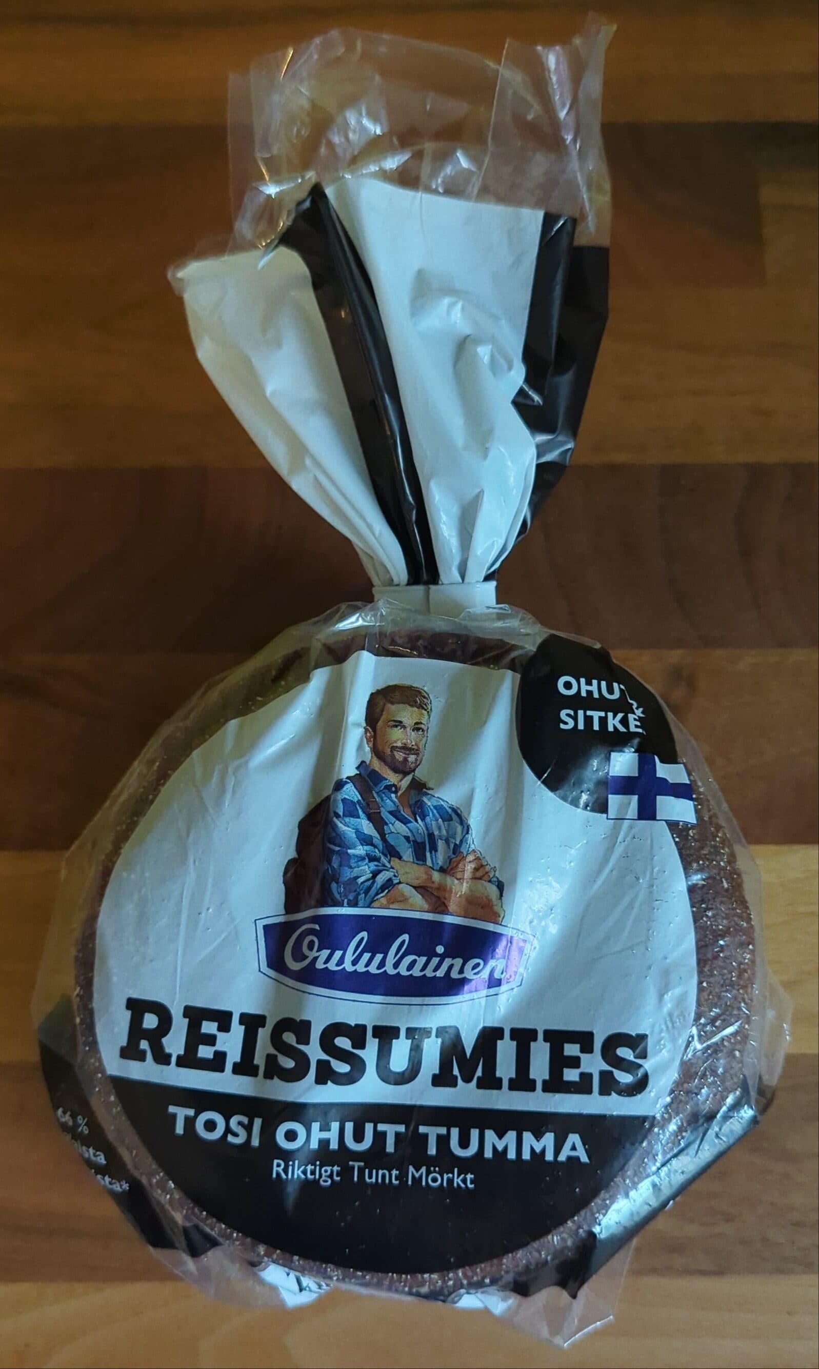 Oululainen Reissumies Tosi ohut tumma packshot