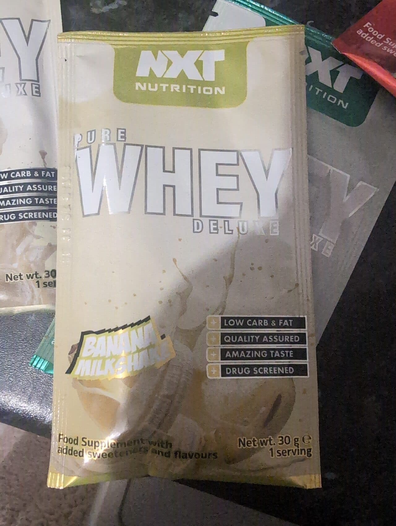 Nxt Nutrition Pure Whey Deluxe Banana Milkshake packshot